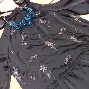 NWT black cold shoulder top with shooting stars
